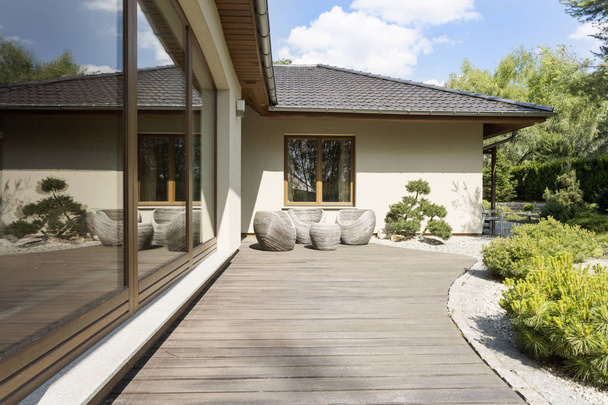 Wooden terrace by suburban villa - Foto, afbeelding