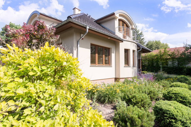 Modern villa exterior surrounded by garden - Фото, зображення