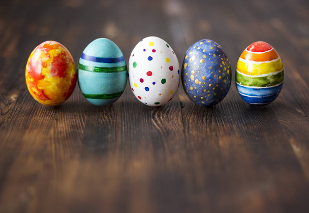 Easter colorful eggs on wooden background - Photo, Image