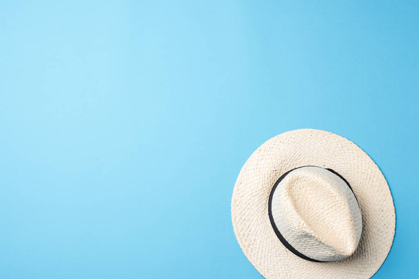 Straw hat on blue background - Fotografie, Obrázek