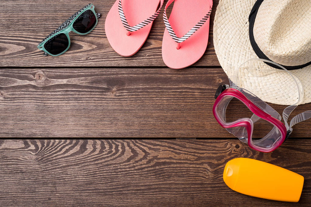 Summer or beach accessories on wooden table. - Valokuva, kuva