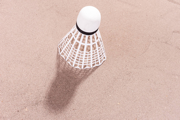 White shuttlecock in the sand - Photo, Image