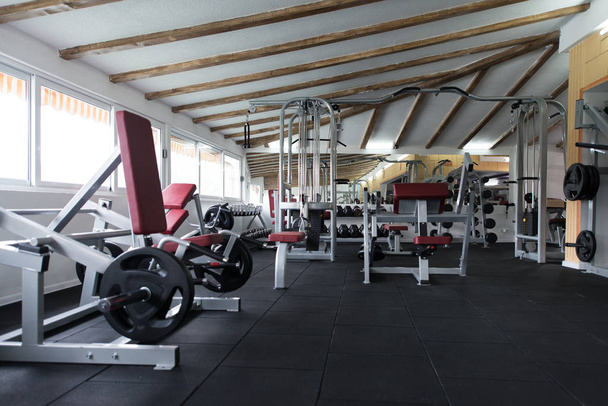 Modern Gym Room Fitness Center With Equipment And Machines - Fotografie, Obrázek