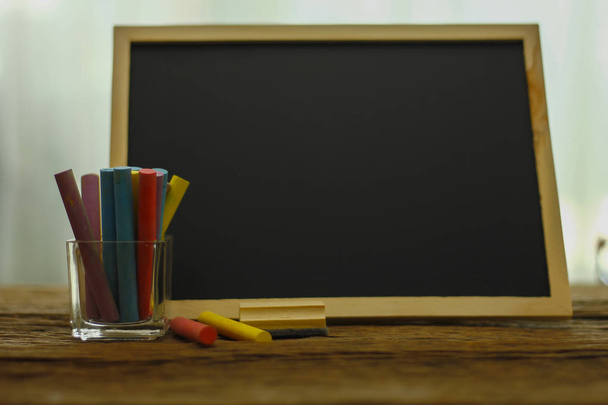 Stock Photo - Colorful crayons on blackboard. Back to school con - Zdjęcie, obraz