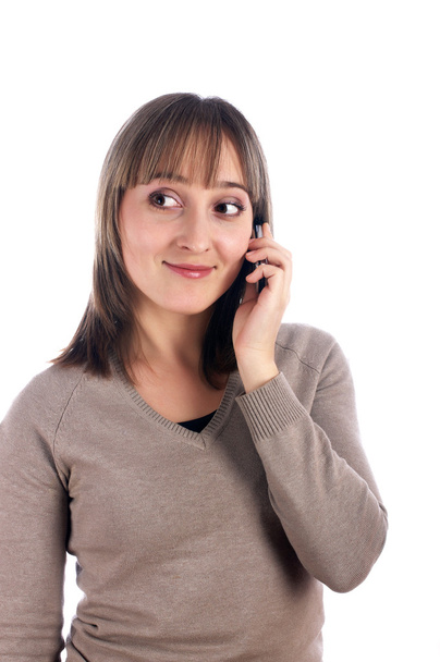 Young female with mobile phone isolated on whit - Photo, Image