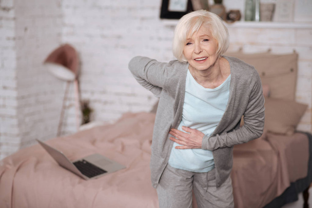 Aged woman with bad backache - Valokuva, kuva