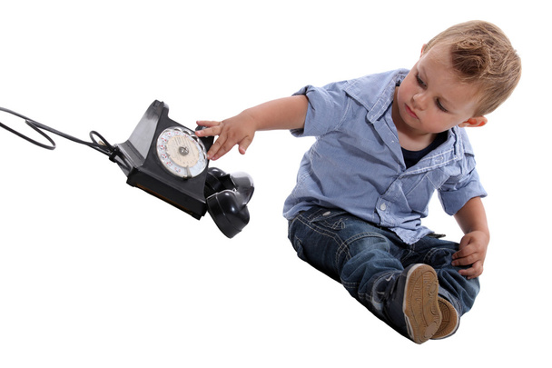 Child playing with a telephone - Foto, Imagen