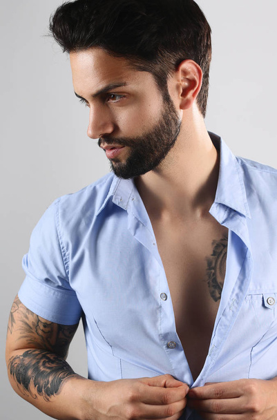 Handsome tattooed man posing  - Photo, Image