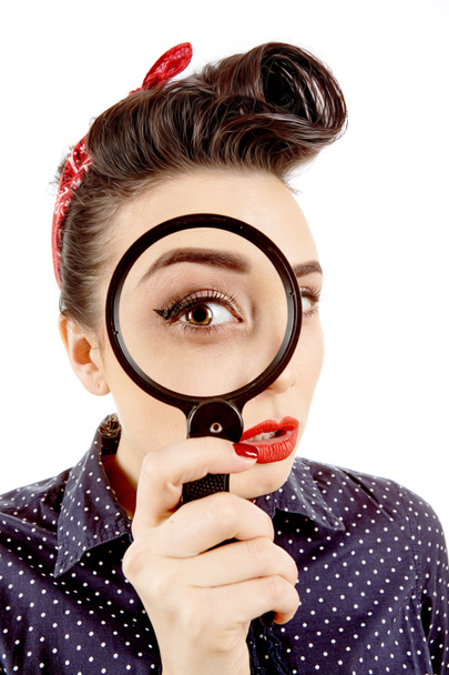 Young pinup girl with magnifying glass - Photo, Image