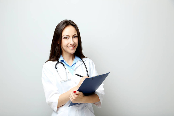 young medical doctor with clipboard - Foto, Imagem
