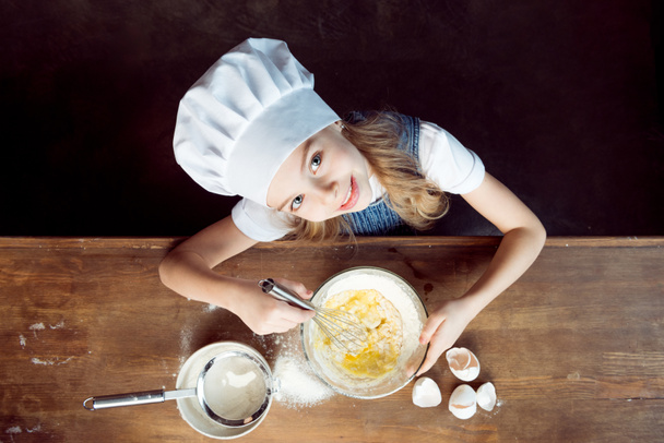 girl making dough for cookies - Fotó, kép