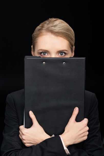 businesswoman with notepad in hands - Φωτογραφία, εικόνα