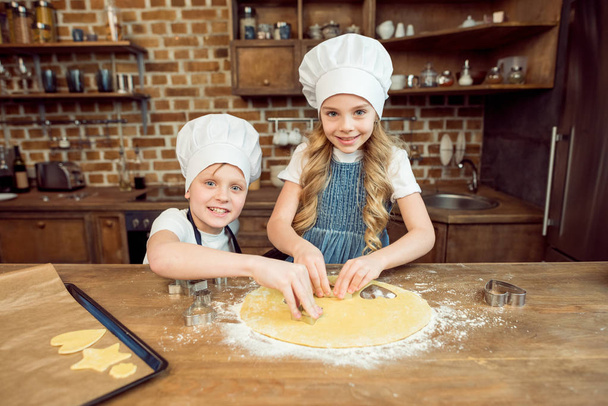 kids making shaped cookies - Photo, Image