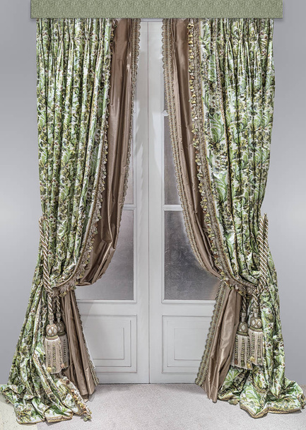 Double curtains for a doorway made of smooth monophonic silk and dense fabric with a pattern. - Photo, Image