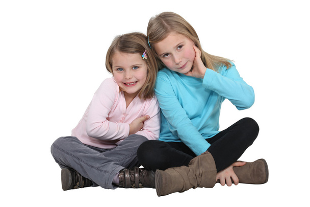 Two little girls posing together - 写真・画像