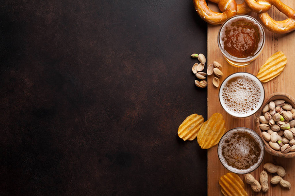 Nuts, chips, pretzels and beer - Photo, Image