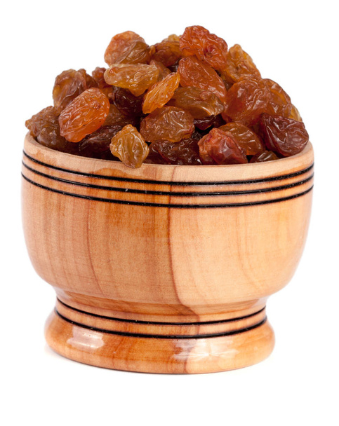 raisins in a wooden bowl isolated on white background - Photo, Image