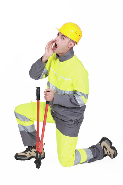 Builder with bolt cutter shouting - Photo, Image