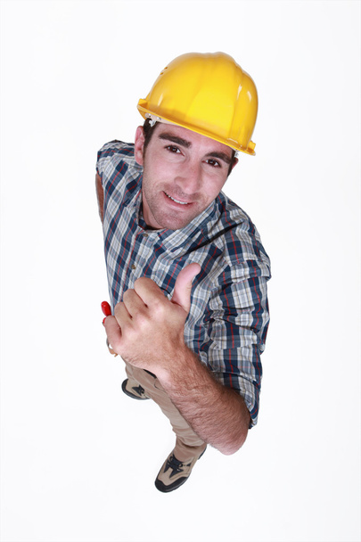 Manual worker giving the thumb up. - Fotó, kép