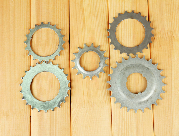 Metal cogwheels on wooden background - Foto, afbeelding