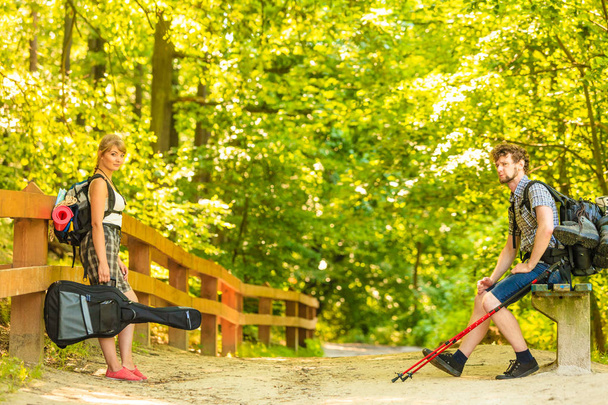 Hiking young couple with guitar backpack outdoor - Photo, Image
