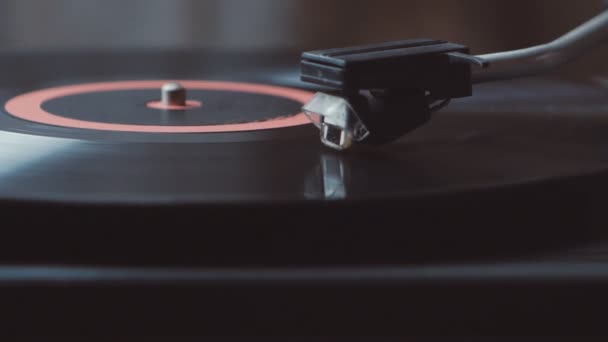 Vinyl rotating on a turntable. A record player turntable with its stylus running along a vinyl record - Footage, Video