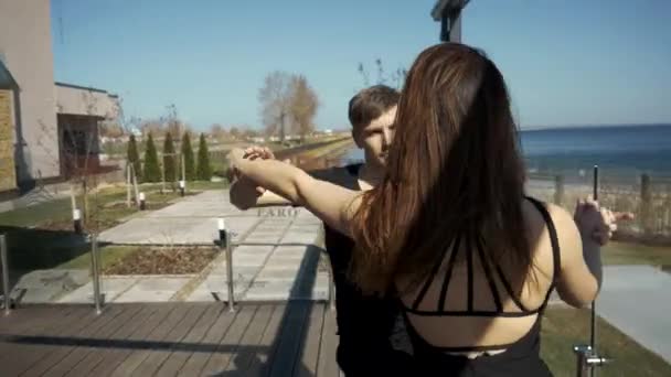 Energetic attractive couple dancing Bachata - Filmati, video