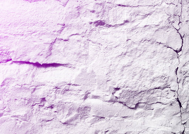 Textur, Muster, Hintergrund. eine mit weißgetünchten Steinen ausgekleidete Wand - Foto, Bild