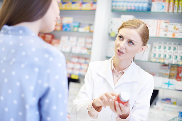 Pharmacist talking to female client  - Fotó, kép