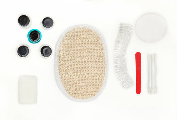 Hotels  set of cosmetics on a white background.  Soap, shampoo, shower gel, conditioner, nail file - Foto, Imagem