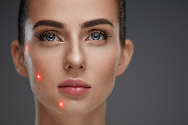 Closeup Of Beautiful Woman Face With Laser Points On Facial Skin - Foto, afbeelding