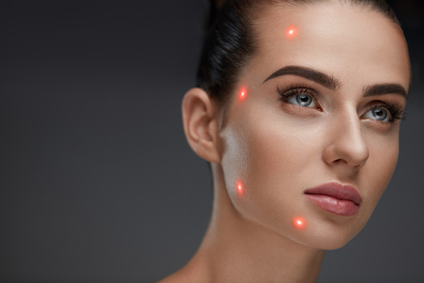 Closeup Of Beautiful Woman Face With Laser Points On Facial Skin - Foto, imagen