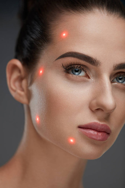 Closeup Of Beautiful Woman Face With Laser Points On Facial Skin - Valokuva, kuva