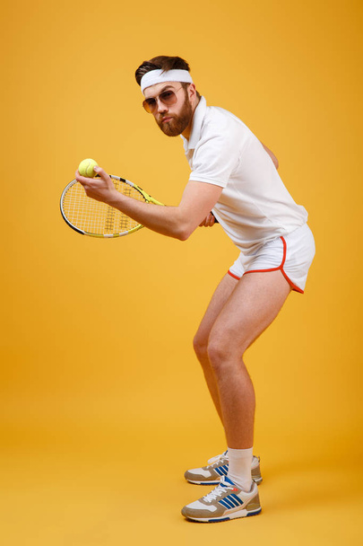 Handsome young tennis player wearing glasses - 写真・画像