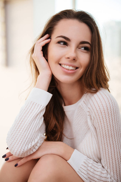Close up portrait of a smiling cute girl in sweater - Photo, Image