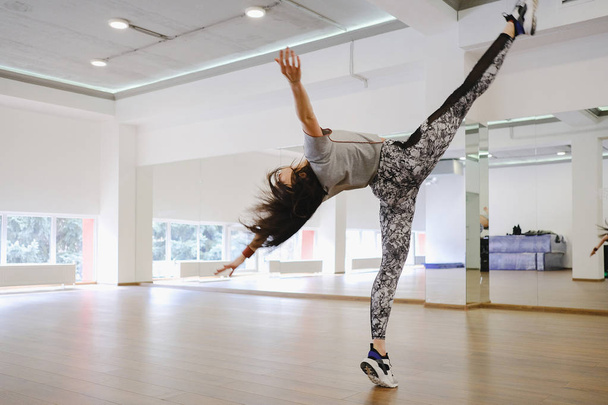 Young modern dancer dancing in the studio - Fotó, kép