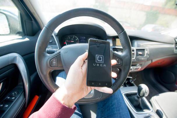 Uber application on smartphone - Фото, изображение