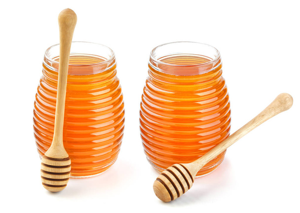 μέλι σε γυάλινο βάζο απομονωθεί σε λευκό φόντο - Φωτογραφία, εικόνα