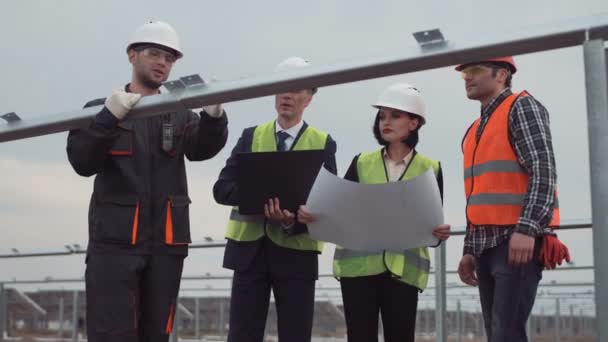 Group of engineers or technicians on a solar farm - Footage, Video