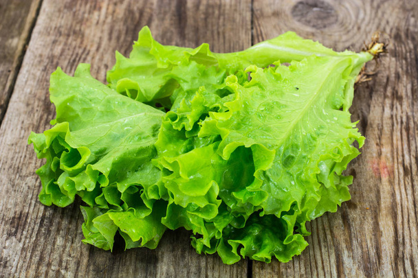 Bunch of fresh green salad. - Фото, изображение