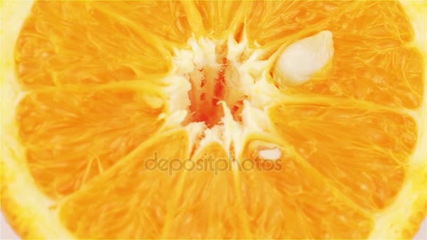Fatia de laranja rotativa, macro. Alimentos orgânicos frescos e saudáveis
 - Filmagem, Vídeo