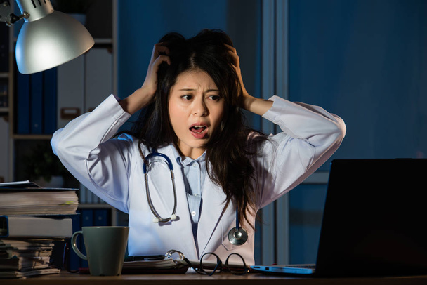 doctor having bad news, stressed out - 写真・画像