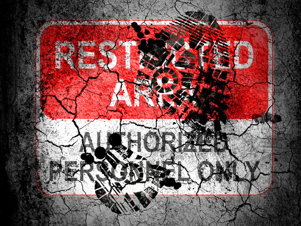 Restricted area sign painted on cracked ground with vignette with dirty oil footprint over it - Photo, Image