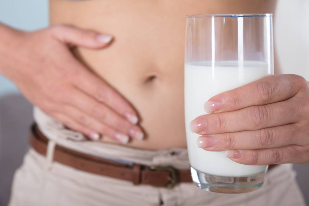 Person Holding Glass Of Milk - Foto, immagini