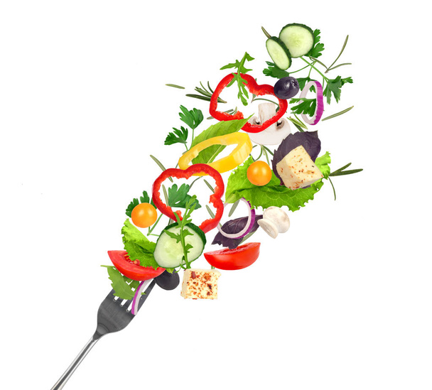 flying vegetable salad .  isolated on white background - 写真・画像