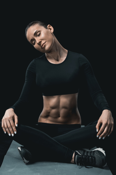 sportswoman stretching neck  - Фото, изображение
