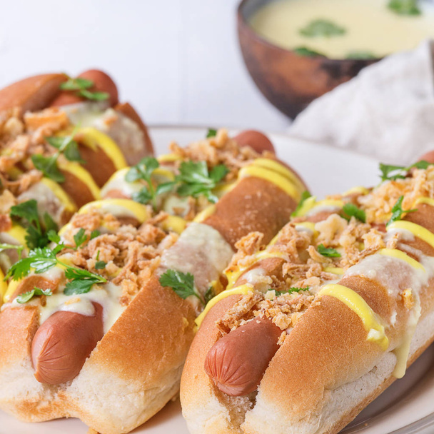 Hot dogs with cheese sauce and mustard - Fotografie, Obrázek