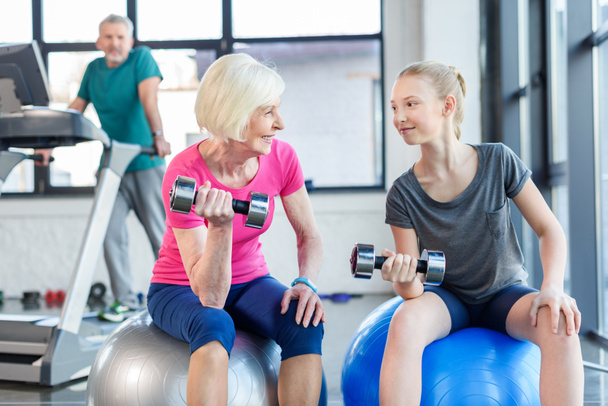 Senior woman with girl in gym  - Photo, Image