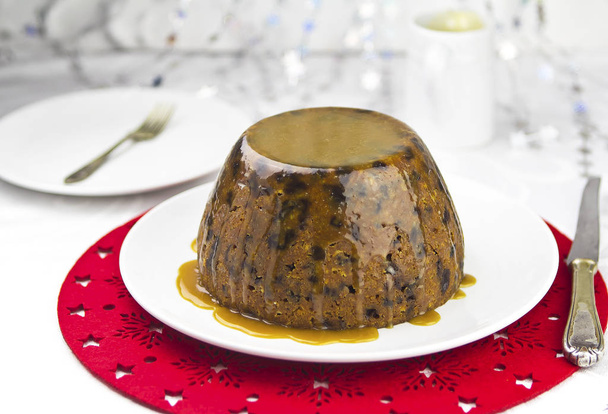 Christmas pudding with caramel sauce - Photo, Image