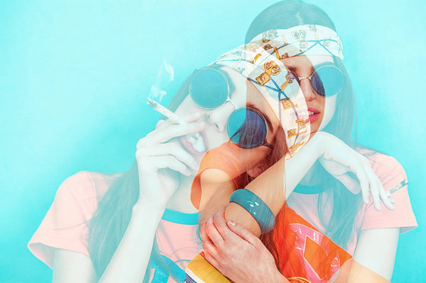 Double exposure of hippy girl portrait smoking weed and wearing sunglasses - Foto, Imagem